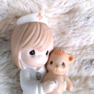 Precious Moments nurse and teddy bear